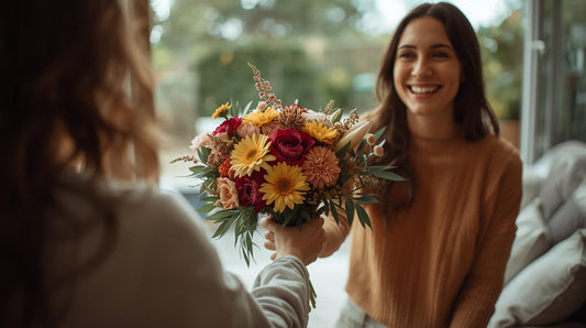 A person handing a fresh flower bouquet to another person as a thank-you gesture, showing appreciation and kindness